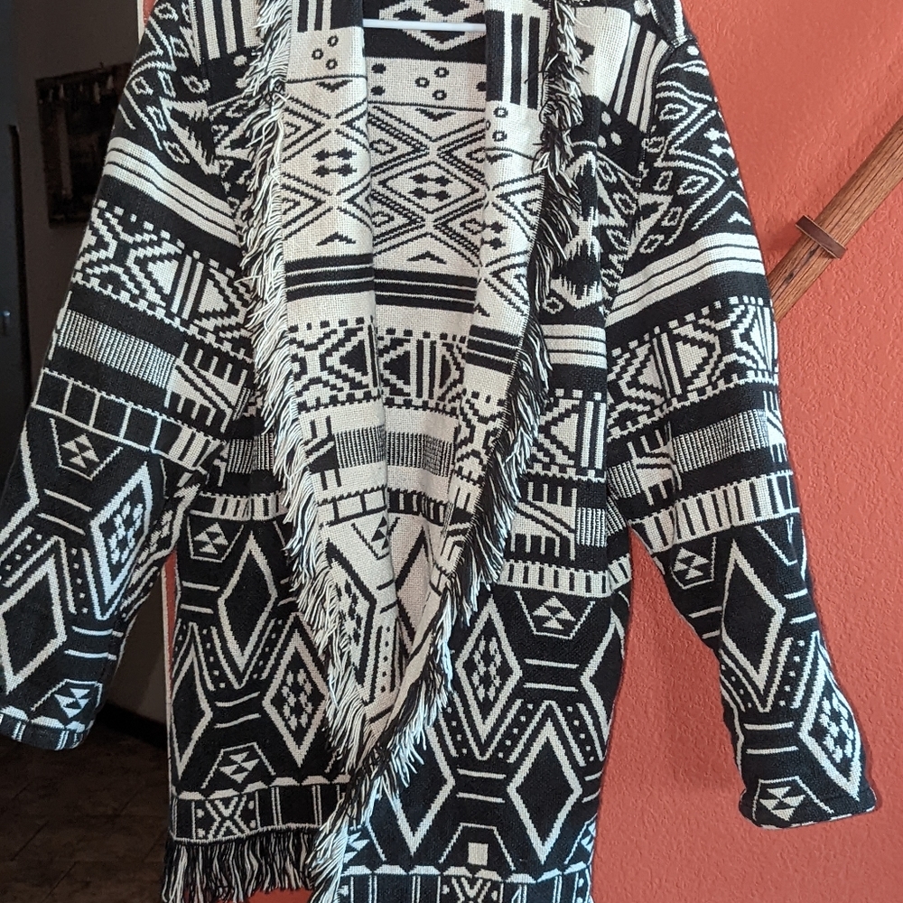 Fringed Aztec black and off white open sweater.